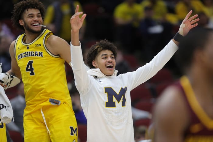 Michigan's Jordan Poole and Isaiah Livers (4) watch the final seconds of the 76-49 win against Minnesota in the Big Ten tournament semifinal Saturday, March 16, 2019 at the United Center in Chicago.